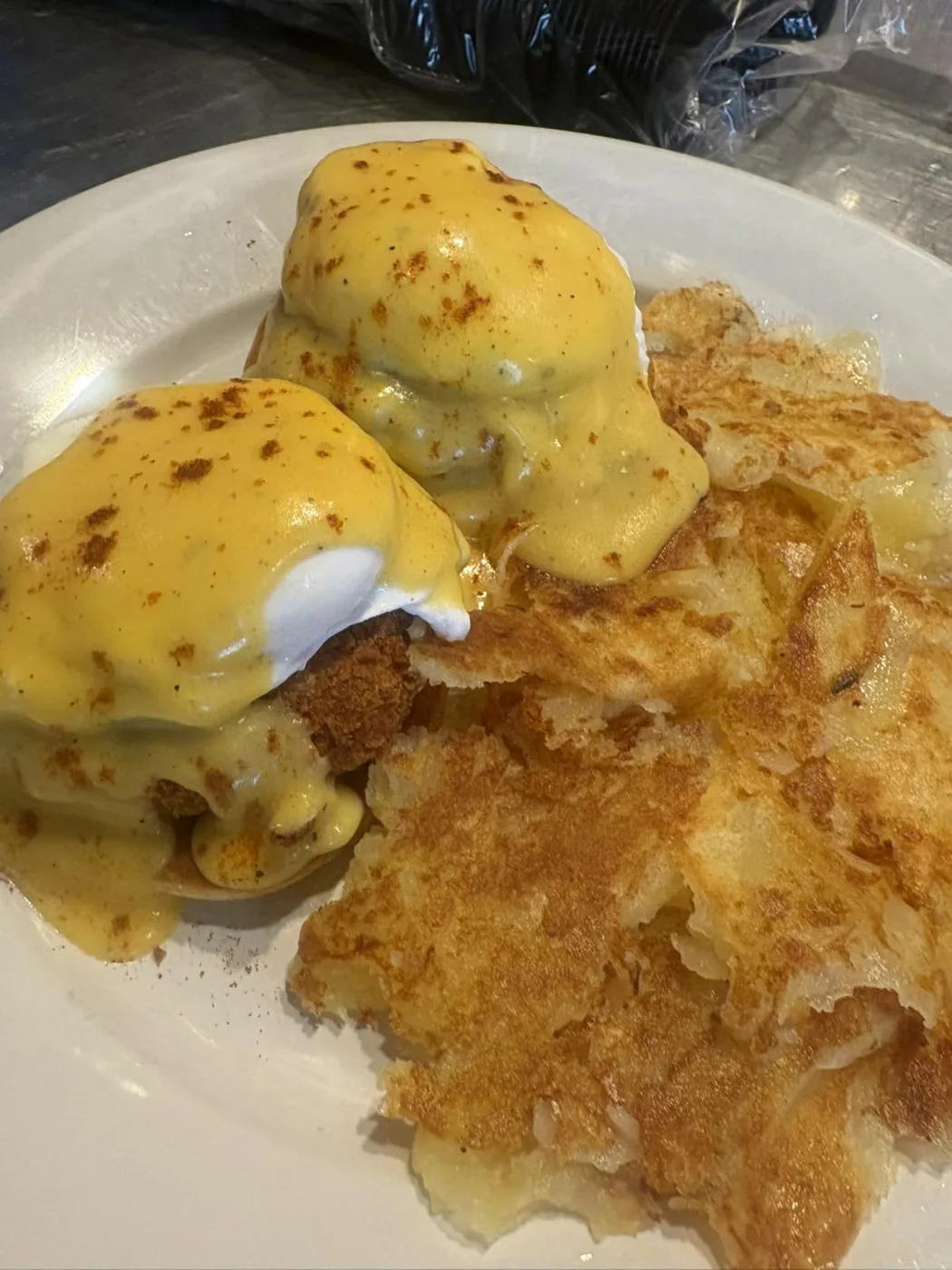 Eggs Benedict over crispy hash browns